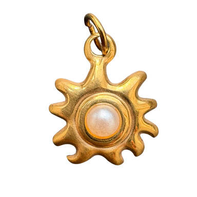 Pearl-centered sun charm
