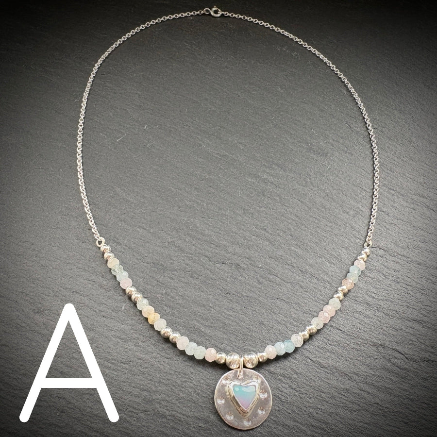 Sterling silver necklace with an Aurora Opal style heart