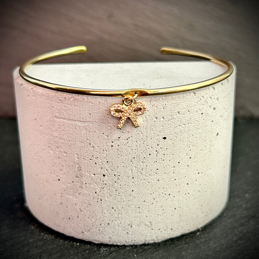 Gold cuff bangle sparkle bow charm