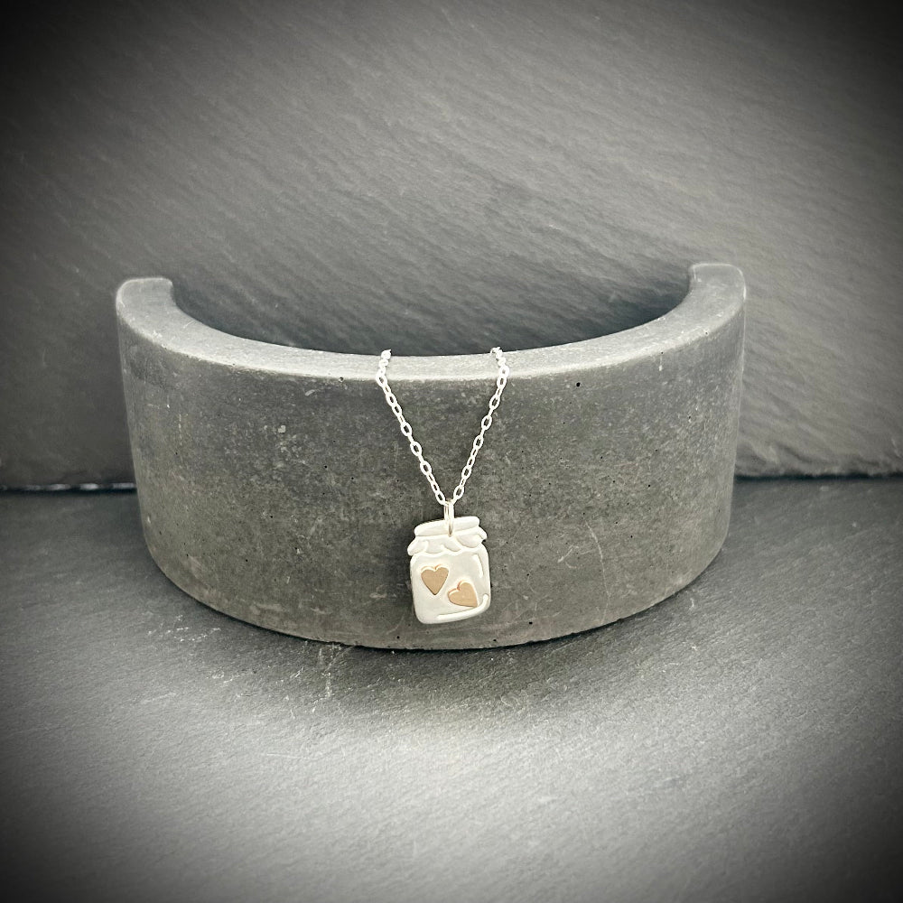 Sterling silver jar of hearts necklace