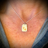 silver and gold jar of hearts necklace
