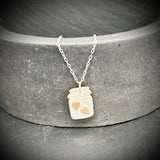 Silver jar pendant with gold hearts