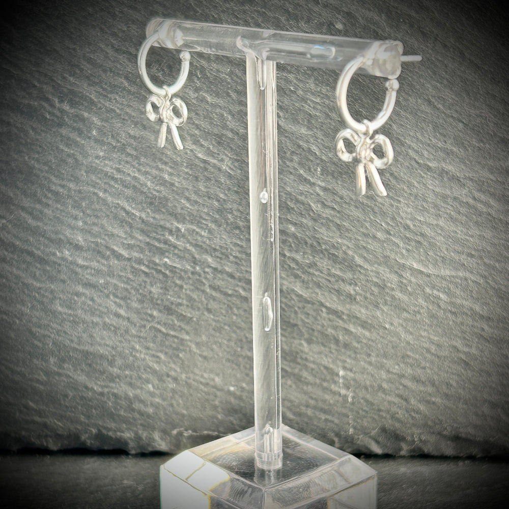 Silver hoop earrings with silver bow 