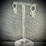 Silver hoop earrings with silver bow 