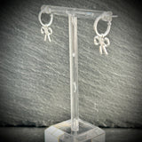 Silver hoop earrings with silver bow 