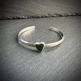 Sterling Silver cuff bangle with a green sea glass heart 