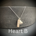 Sterling Silver heart pendant necklace with Ruby with love stamped tag