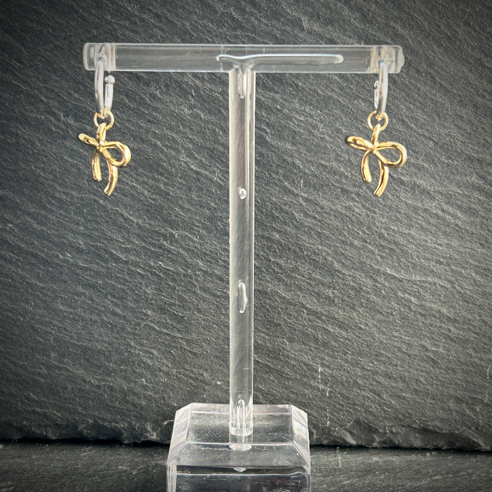 Silver hoop earrings with gold bow 