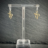 Silver hoop earrings with gold bow 